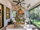 Cozy screened porch with stone fireplace and ceiling fan, perfect for relaxing outdoors at 19419 Youngblood W Rd # 2, Charlotte, NC 28278