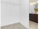 Walk-in closet combined with a bathroom showing the tiled floor and a small vanity at 25966 Appleyard Ct # 1205, Lancaster, SC 29720