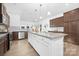 Beautiful kitchen featuring an island with granite countertops, hardwood floors, and stainless appliances at 25966 Appleyard Ct # 1205, Lancaster, SC 29720