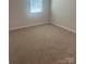 Bright bedroom with neutral carpeting and ample natural light at 2616 Tillman St, Monroe, NC 28112