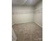Carpeted walk-in closet providing ample storage with wire shelving at 2616 Tillman St, Monroe, NC 28112