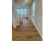 Inviting entryway featuring wood floors and staircase leading to the second floor at 2616 Tillman St, Monroe, NC 28112