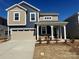 Two story home featuring attached two car garage and covered entryway at 2616 Tillman St, Monroe, NC 28112
