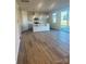 Modern kitchen featuring an island with pendant lights, stainless appliances, and sliding glass doors at 2616 Tillman St, Monroe, NC 28112
