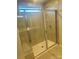 Modern shower with glass doors, tiled walls, and convenient built-in bench at 2616 Tillman St, Monroe, NC 28112
