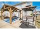 Backyard featuring pergolas and a patio area with outdoor seating, ideal for relaxing and entertaining at 279 Age Old Way, Rock Hill, SC 29732
