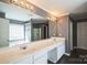 Bright bathroom featuring double sinks, a large mirror, and a separate bathtub and shower at 279 Age Old Way, Rock Hill, SC 29732