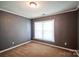 Bedroom with neutral walls, carpet, a window, and white trim at 279 Age Old Way, Rock Hill, SC 29732