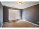 Neutral bedroom with a large window and carpeted flooring offers a serene retreat at 279 Age Old Way, Rock Hill, SC 29732
