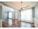 Inviting dining room with hardwood floors, elegant chandelier, and abundant natural light at 279 Age Old Way, Rock Hill, SC 29732