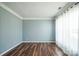 Empty living room featuring laminate floors, light blue walls, and lots of natural light at 279 Age Old Way, Rock Hill, SC 29732