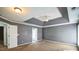 Spacious main bedroom features a tray ceiling with a ceiling fan, and neutral walls at 279 Age Old Way, Rock Hill, SC 29732