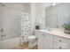 Bathroom featuring a shower-tub combo, vanity, and tile flooring at 2941 Bellasera Way, Matthews, NC 28105