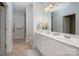 Bathroom featuring double sinks, a large mirror, and a tiled floor at 2941 Bellasera Way, Matthews, NC 28105