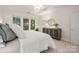 Cozy bedroom with soft carpet, a large window, and a stylish dresser at 2941 Bellasera Way, Matthews, NC 28105