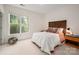 Bedroom with a large window providing ample natural light and a rustic headboard at 2941 Bellasera Way, Matthews, NC 28105