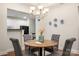 Charming dining area with a round table, upholstered chairs, and modern chandelier for cozy meals at 2941 Bellasera Way, Matthews, NC 28105