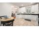 Functional kitchen offers white cabinetry, dark countertops, and an eat-in area with natural light at 2941 Bellasera Way, Matthews, NC 28105