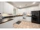 Well-maintained kitchen features white cabinetry, modern appliances, and a practical tile backsplash at 2941 Bellasera Way, Matthews, NC 28105