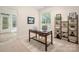 Inviting office area with a comfortable chair, functional desk, and lots of natural light at 2941 Bellasera Way, Matthews, NC 28105
