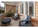 Inviting patio with comfortable seating, stone accents and an outdoor fireplace, perfect for relaxation at 2941 Bellasera Way, Matthews, NC 28105
