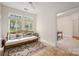 Relaxing sunroom with many windows, a wooden bench, and tile flooring, perfect for enjoying the natural light at 2941 Bellasera Way, Matthews, NC 28105