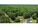 Aerial view showcasing the home, outbuildings, and surrounding lush greenery, providing a serene living environment at 3039 Paraham S Rd, York, SC 29745