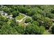Aerial view showcasing the home, wooded lot, and proximity to the main road at 3039 Paraham S Rd, York, SC 29745