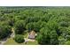 Aerial view of the home surrounded by lush greenery, a long driveway, and ample space at 3039 Paraham S Rd, York, SC 29745