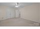 This bedroom features neutral walls, carpet, and double door closet and an entry to the bathroom at 3039 Paraham S Rd, York, SC 29745