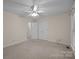 This bedroom features neutral walls, carpet, and double doors to closet and a door to the hallway at 3039 Paraham S Rd, York, SC 29745
