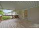 Spacious covered deck with a wooden railing and an entrance to the house, perfect for outdoor living and entertaining at 3039 Paraham S Rd, York, SC 29745