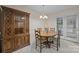 Traditional dining room with a wood table, chairs, china cabinet, and a chandelier, creating a warm, inviting space at 3039 Paraham S Rd, York, SC 29745