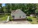 View of home with brick foundation, shed, ramp access, and expansive greenery at 3039 Paraham S Rd, York, SC 29745