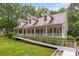 Charming one-story home with dormers,a welcoming front porch with ramp access and manicured lawn at 3039 Paraham S Rd, York, SC 29745