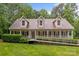 Inviting one-story home with charming front porch,dormers,ramp access, and well-manicured lawn at 3039 Paraham S Rd, York, SC 29745