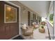 Charming front porch offers a welcoming seating area and decorative front door at 3039 Paraham S Rd, York, SC 29745