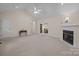 Spacious living room featuring vaulted ceilings, a ceiling fan, and a cozy fireplace with adjacent dining room at 3039 Paraham S Rd, York, SC 29745