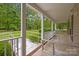 Inviting front porch with white columns and a lush lawn, offering a serene outdoor space to enjoy the surroundings at 3039 Paraham S Rd, York, SC 29745