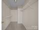 This walk-in closet features shelving on the walls and carpeted flooring at 3039 Paraham S Rd, York, SC 29745