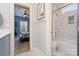 View into the bathroom, showcasing a tub with a shower and tiled walls at 3439 Richards Xing, Fort Mill, SC 29708