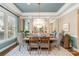 Elegant dining room with large windows, stylish chandelier, and seating for six at 3439 Richards Xing, Fort Mill, SC 29708