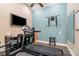 Well-equipped exercise room with a treadmill, mounted TV, and workout accessories at 3439 Richards Xing, Fort Mill, SC 29708