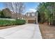 Two-car garage with an extended driveway and basketball hoop, perfect for Gathering fun at 3439 Richards Xing, Fort Mill, SC 29708