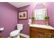 Stylish powder room with designer fixtures and purple colored walls at 3439 Richards Xing, Fort Mill, SC 29708
