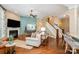 Spacious living room with fireplace, hardwood floors, and adjacent dining area at 3439 Richards Xing, Fort Mill, SC 29708
