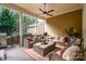 Covered patio area featuring comfortable seating, outdoor fan, and lush surroundings at 3439 Richards Xing, Fort Mill, SC 29708