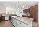 Bright and airy kitchen featuring a large island, stainless steel appliances, and plenty of counter space at 40189 Crooked Stick Dr # 1205, Lancaster, SC 29720