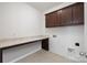 The laundry room features tile floors, cabinets, and a folding counter at 40189 Crooked Stick Dr # 1205, Lancaster, SC 29720