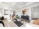 A sun-filled living room features contemporary decor, stylish seating, and a chic coffee table at 40189 Crooked Stick Dr # 1205, Lancaster, SC 29720